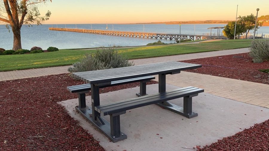 Outdoor table with bench seating made from recycled plastic containers